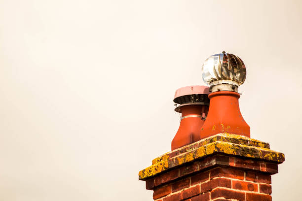 A typical household chimney stack taken from ground view up to it.